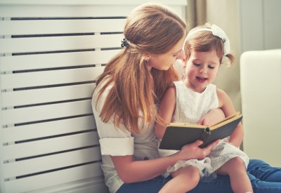 happy family mother child little girl reading book